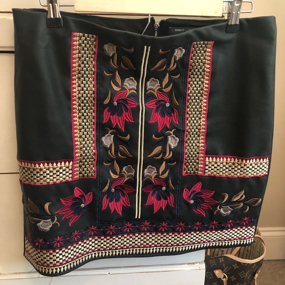 Black leather mini skirt with embroidery